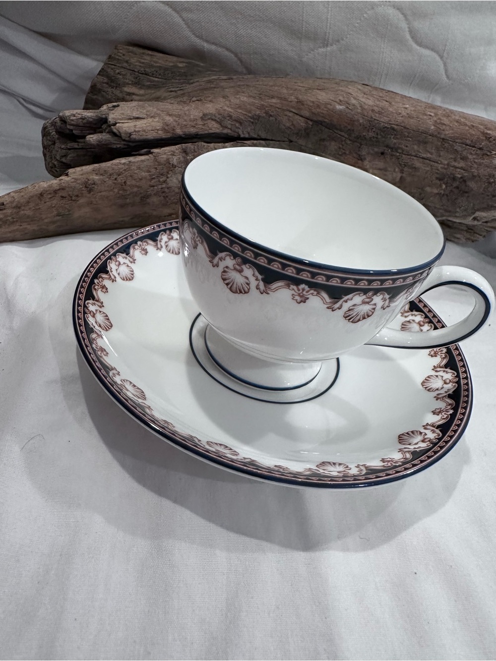 Footed teacup and saucer set is Medici pattern by Wedgwood